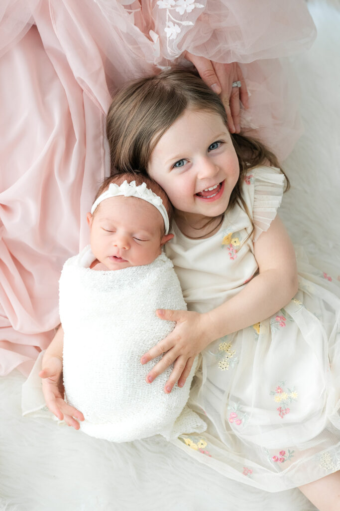 Photos of newborn with siblings