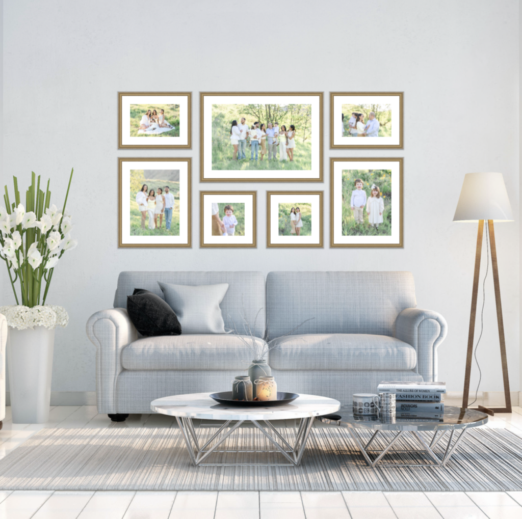 Snow Basin fall family photos displayed as a custom heirloom gallery wall above a living room sofa, showcasing beautifully framed family portraits designed to preserve cherished autumn memories for generations.